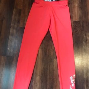 NIKE Red leggings with metallic futura logo